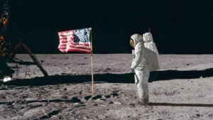 astronaut on moon saluting USA flag